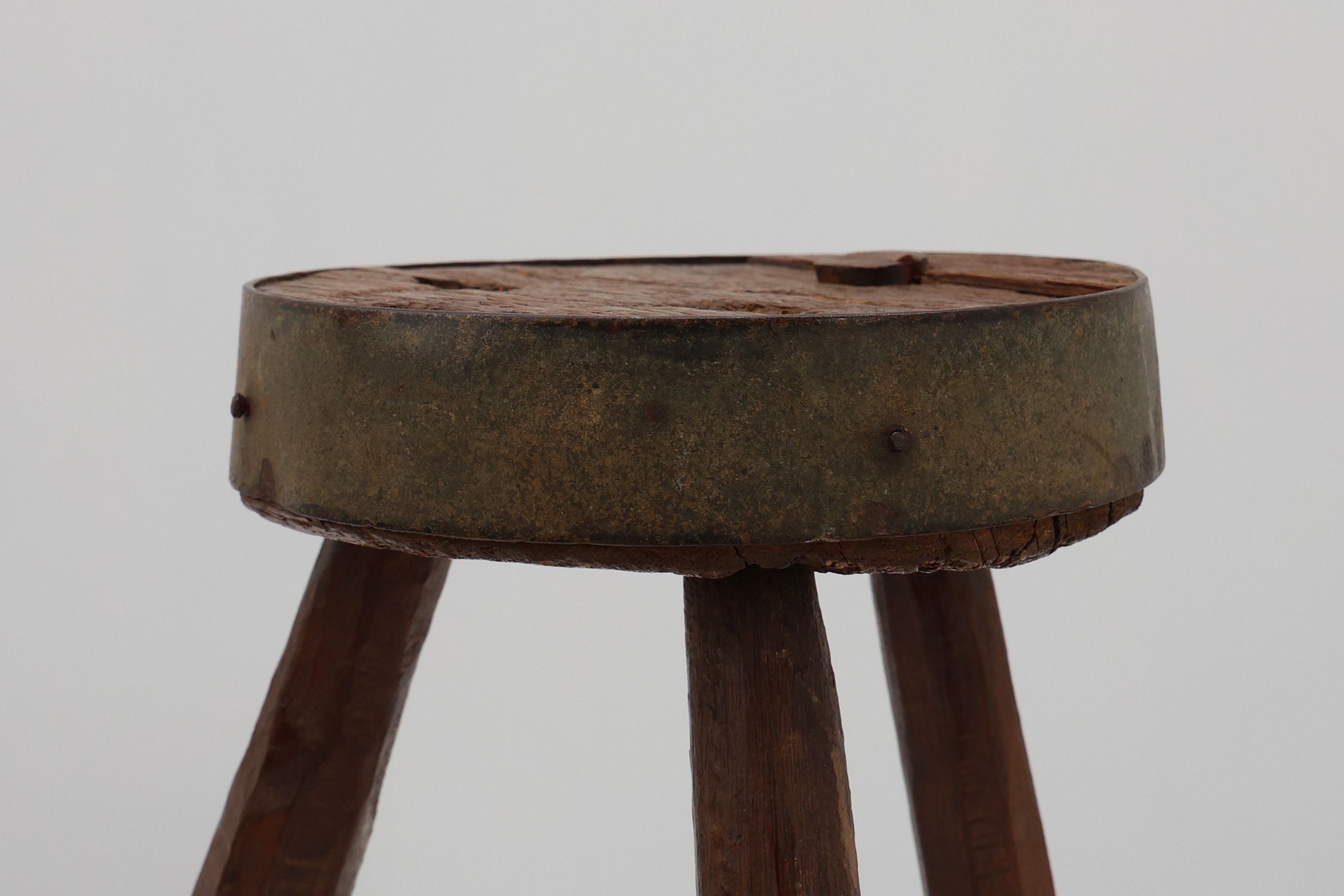 Brutalist French 1850s solid oak tripod stools with metal rim, set of 4thumbnail
